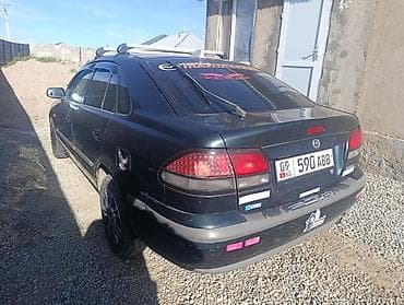 кочкор авто: Mazda 323: 1999 г., 1.8 л, Кол менен иштөөчү, Бензин, Седан — 10