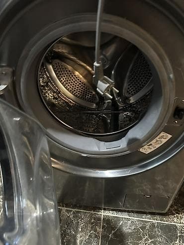 Стиральная машина LG с фронтальной загрузкой, корпус из нержавеющей