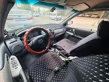bcd com kg: Mazda 323: 2002 г., 1.6 л, Автомат, Бензин, Хэтчбэк — 5