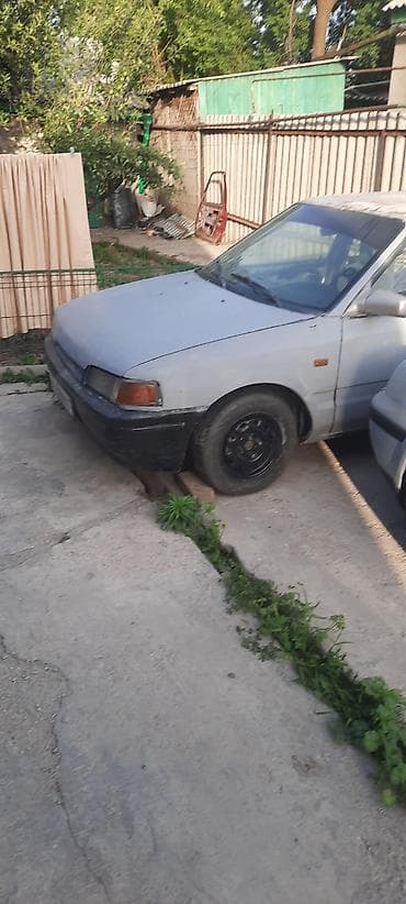 разный: Mazda Familia: 1990 г., 1.6 л, Механика, Бензин, Седан — 2