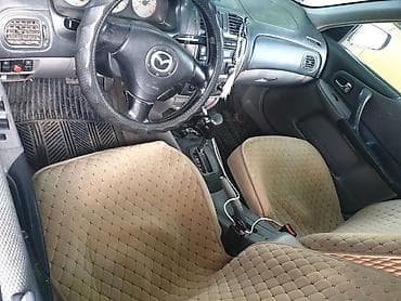 Mazda 323: 2002 г., Автомат — 3