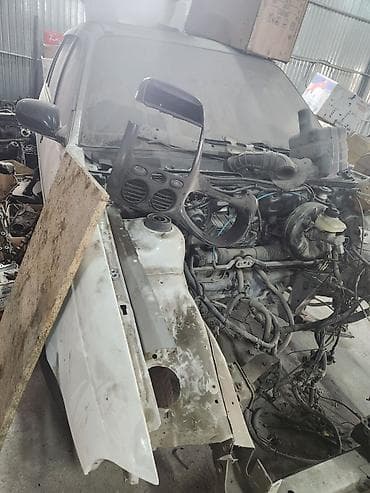 Кузов и запчасти на Daewoo Nexia (седан, белый цвет) — разбор по