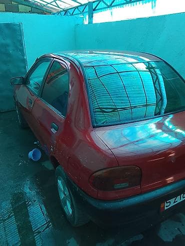 mini vci: Mazda 121: 1993 г., 1.3 л, Механика, Бензин, Седан — 2