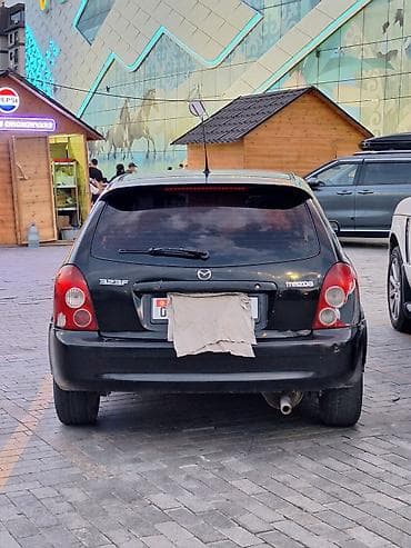 mazda 626 1998: Mazda 323: 2002 г., 1.3 л, Механика, Бензин, Универсал — 2
