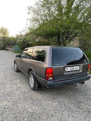 глушитель субару аутбек: Mazda 626: 1989 г., 2 л, Механика, Бензин, Универсал — 1
