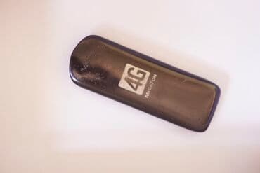 Аудиотехника: USB-модем Megafon 4G в черном корпусе. Предназначен для обеспечения — 2