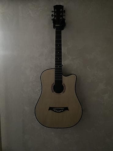 Акустическая гитара с вырезом (cutaway) - Корпус дредноут с вырезом