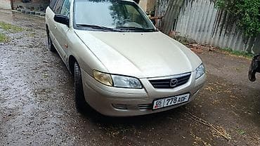 Транспорт: Mazda Capella: 2002 г., 1.8 л, Механика, Бензин, Универсал — 1