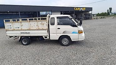 Hyundai Porter (двухдверный бортовой малотоннажник) Портер 1 2001г — 2