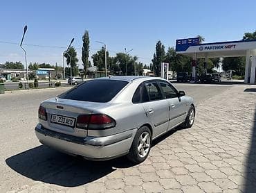 126 кузов: Mazda 626: 1997 г., Механика, Бензин, Хэтчбэк — 4