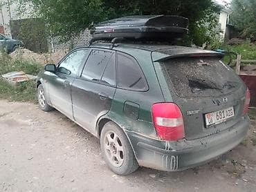 mazda 6e: Mazda 323: 1999 г., 1.6 л, Механика, Бензин, Универсал — 3