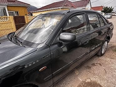 Унаа сатуу: Mazda 626: 1997 г., 1.8 л, Кол менен иштөөчү, Бензин, Хетчбек — 9