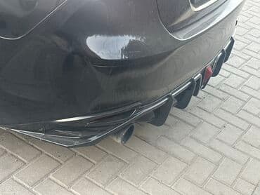 мухабойка на срв: Юбка заднего бампера Toyota, 2023 г., цвет - Черный — 6