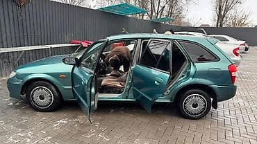 некая 3: Mazda Familia: 2003 г., 1.6 л, Автомат, Бензин, Универсал — 6