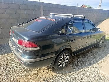 кочкор авто: Mazda 323: 1999 г., 1.8 л, Кол менен иштөөчү, Бензин, Седан — 2
