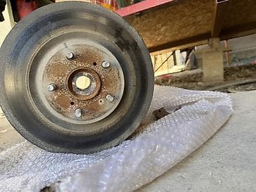 полуось мтз: Передняя ступица в сборе с тормозным диском + рычаг подвески — 1