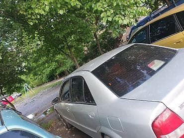 Mazda 323: 2002 г., Автомат — 4