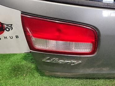 Фонарь крышки багажника NISSAN LIBERTY M12 2 1998 лев. (б/у)
