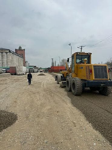 бетон кесебиз: Автогрейдер XCMG (дорожный грейдер) Описание: - Колёсный автогрейдер — 1