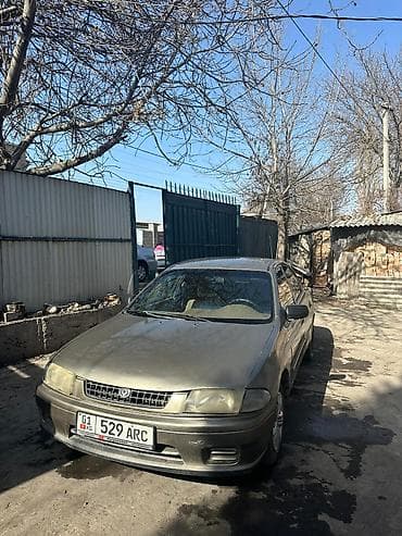 3c te: Mazda 323: 1998 г., 1.6 л, Автомат, Бензин, Седан — 5
