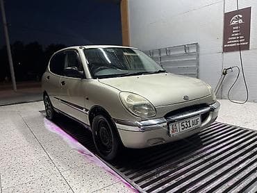 b v d: Daihatsu Storia: 1999 г., 0.9 л, Автомат, Бензин, Хэтчбэк — 4