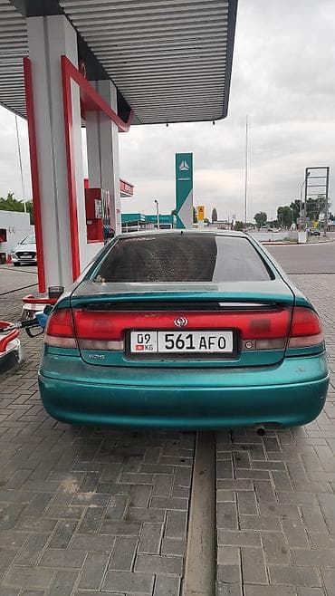 Транспорт: Mazda Cronos: 1996 г., 1.8 л, Кол менен иштөөчү, Бензин, Хетчбек — 6