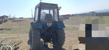 бу шины на трактор: Трактор синего цвета, оснащенный кабиной для оператора, обеспечивающей — 2