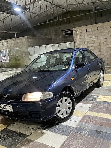 люки крыши: Mazda 323: 1997 г., 1.5 л, Автомат, Бензин, Седан — 2