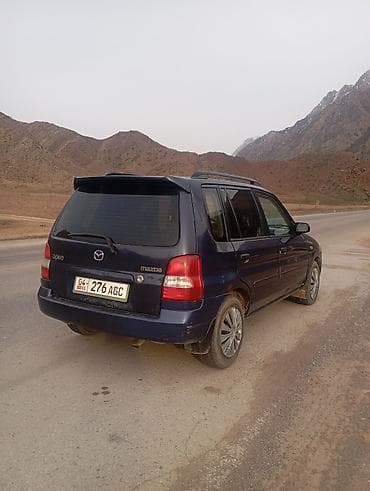 унаалар: Mazda Demio: 2001 г., 1.5 л, Кол менен иштөөчү, Бензин, Хетчбек — 9