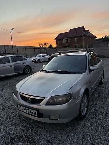 pes 2013: Mazda 323: 2003 г., 1.6 л, Механика, Бензин, Седан — 3