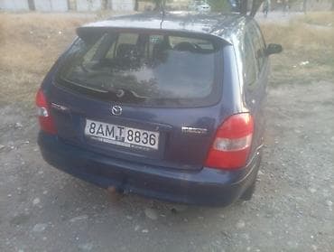 e klass: Mazda 323: 2000 г., Механика, Бензин — 2