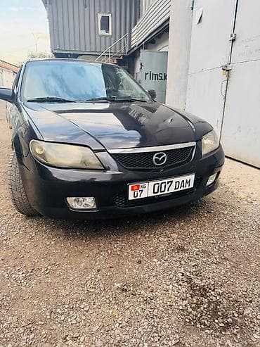 bcd com kg: Mazda 323: 2002 г., 1.6 л, Автомат, Бензин, Хэтчбэк — 1