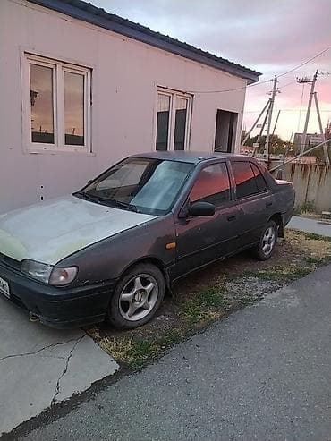 Транспорт: Nissan Sunny: 1991 г., 1.4 л, Механика, Бензин, Седан — 1