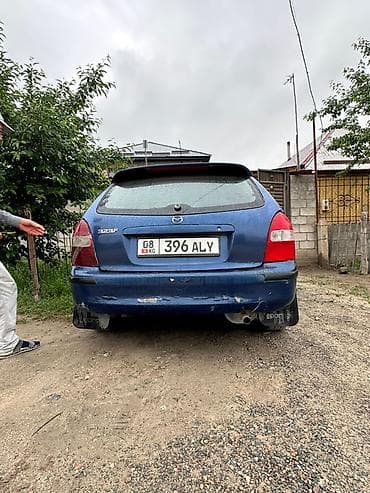 Транспорт: Mazda 323: 2001 г., 1.6 л, Кол менен иштөөчү, Бензин, Хетчбек — 5