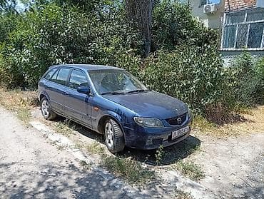 e2 byd: Mazda 323: 2002 г., 1.6 л, Механика, Бензин, Универсал — 5