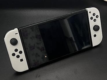 Nintendo Switch OLED (белая) - Экран 7" OLED с яркими цветами и