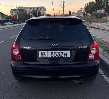 полик нексия 2: Mazda 323: 2002 г., Механика, Универсал — 2