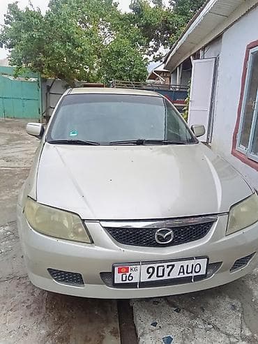 Mazda 323: 2003 г., 1.6 л, Механика, Бензин, Хэтчбэк — 1
