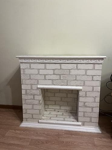 Декоративный камин. Делали своими руками . Сделан из гипсокартона и