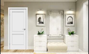 Белая межкомнатная дверь с двумя филенками и серебристой ручкой. Такая