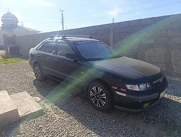 кочкор авто: Mazda 323: 1999 г., 1.8 л, Кол менен иштөөчү, Бензин, Седан — 5
