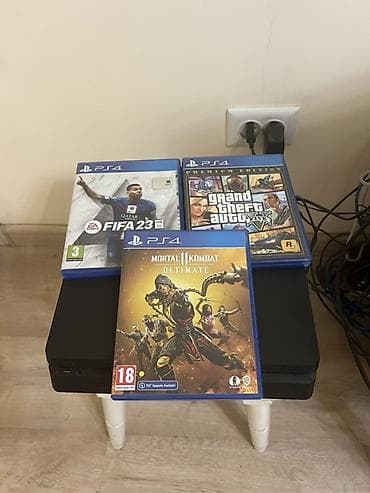 sony play: Игровая приставка Sony PlayStation 4 Slim (чёрная) с набором игр на — 1