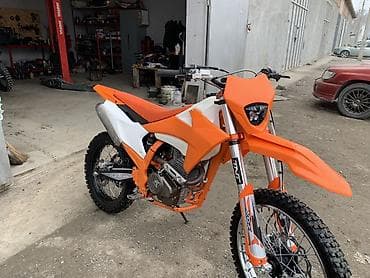 Мототехника: Эндуро/кросс мотоцикл оранжево‑белого цвета. Особенности и — 2
