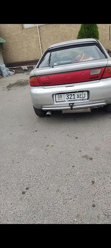 Унаа: Mazda 323: 1996 г., 0.5 л, Кол менен иштөөчү, Бензин, Лифтбек — 2