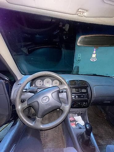 кузов нексия 2: Mazda 323: 1999 г., 1.6 л, Механика, Бензин, Седан — 9