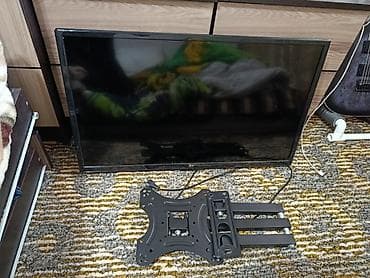 телевизор с подставкой: Телевизор LG с настенным поворотно-выдвижным кронштейном - Диагональ — 1