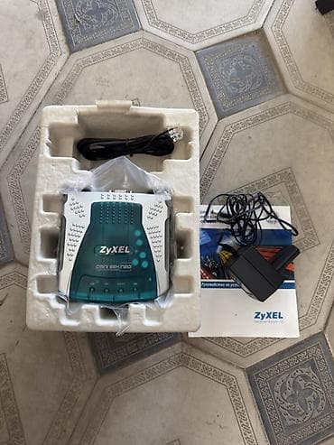 ZyXEL Omni 56K NE0 — внешний факс‑модем для аналоговой телефонной