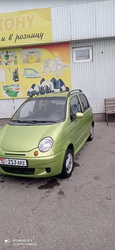 Автомобиль компакт-класса хэтчбек, 5 дверей, зелёный цвет. Киргизские