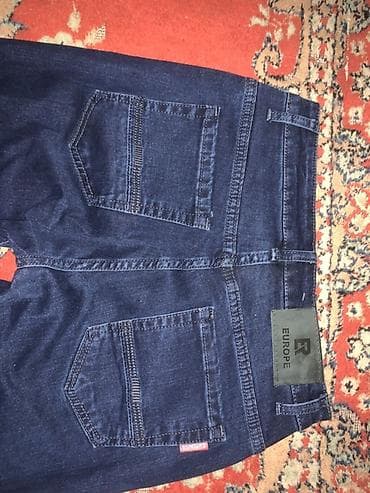 оптом рубашки: Джинсы темно‑синие (индиго), прямой крой с легким заужением к низу — 5