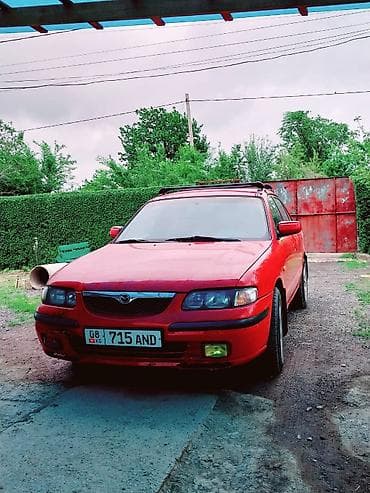 фара 200: Mazda 626: 1997 г., 1.8 л, Механика, Бензин, Седан — 2